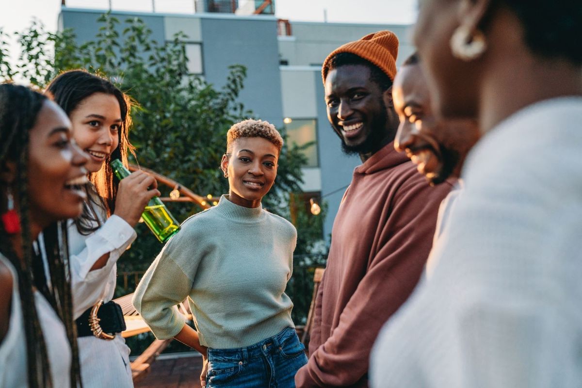 A group of friends hanging out and smiling.